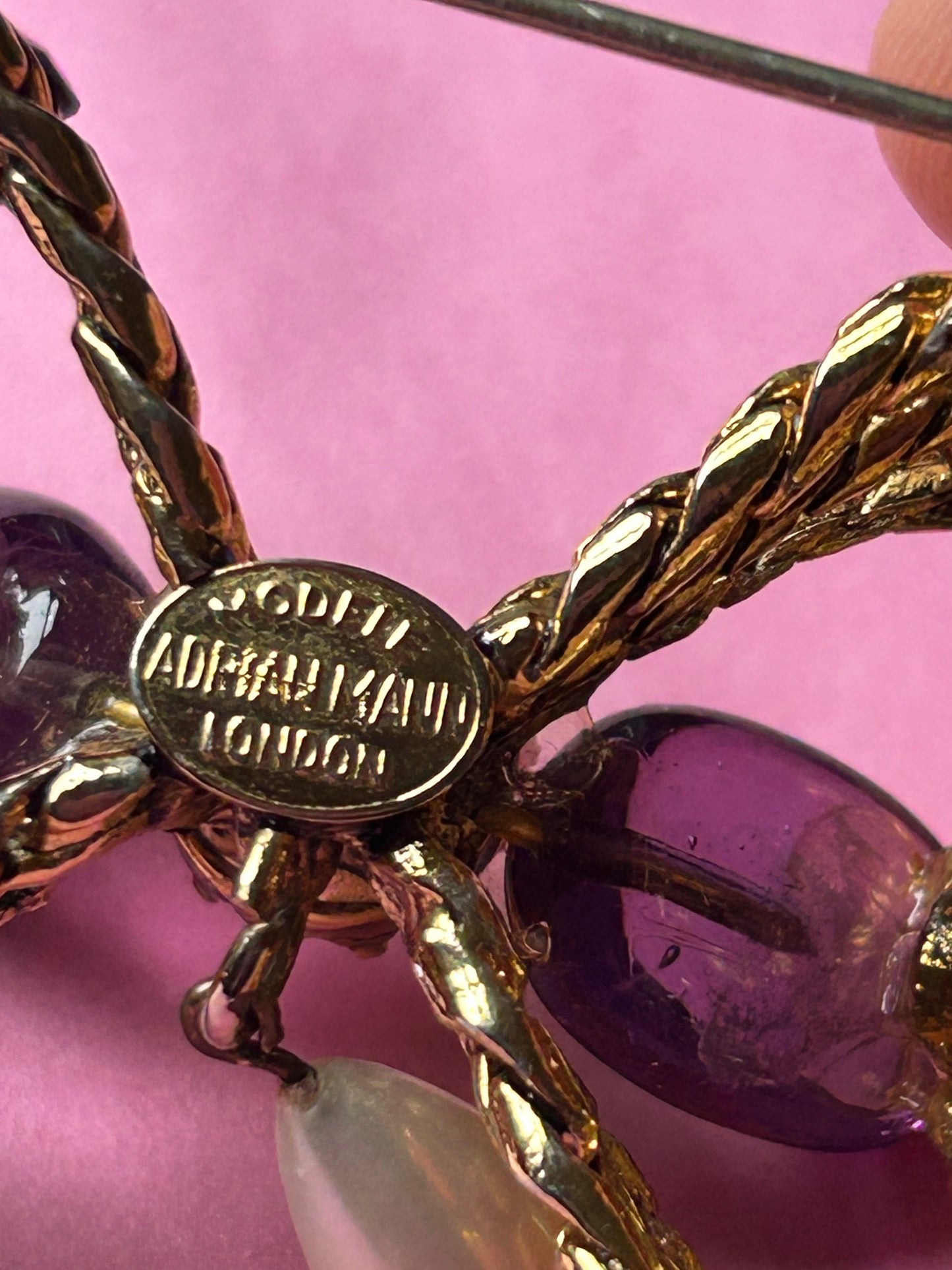 Pretty Vintage Brooch Signed Adrian Mann Bow with Amethyst Stones.