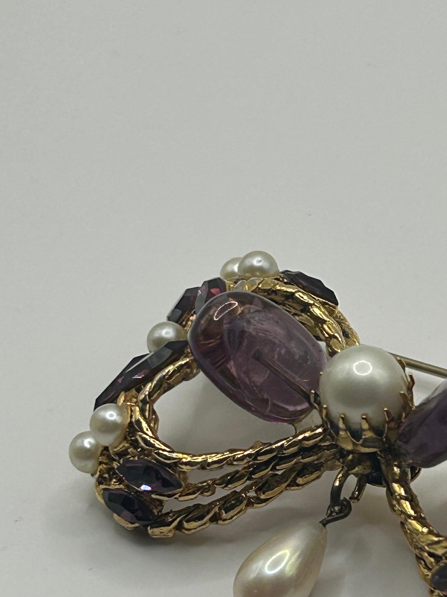 Pretty Vintage Brooch Signed Adrian Mann Bow with Amethyst Stones.