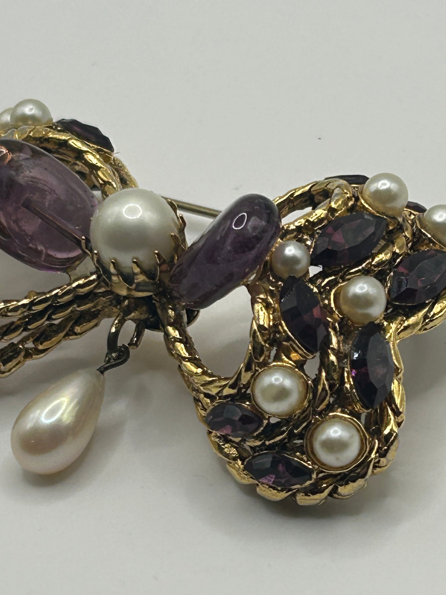 Pretty Vintage Brooch Signed Adrian Mann Bow with Amethyst Stones.