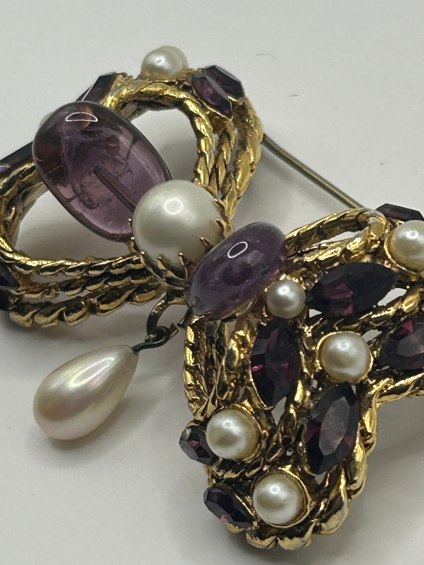 Pretty Vintage Brooch Signed Adrian Mann Bow with Amethyst Stones.