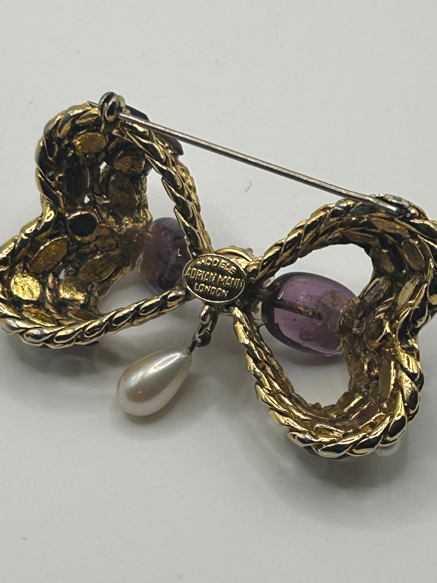 Pretty Vintage Brooch Signed Adrian Mann Bow with Amethyst Stones.