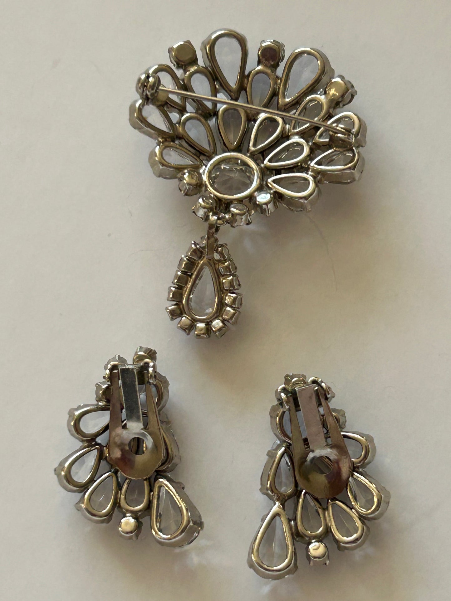 Vintage crystal set brooch and clip on earrings.